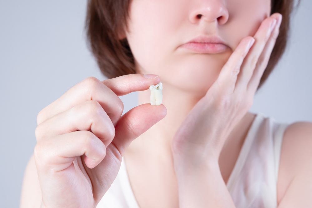 Woman Holding Wisdom tooth